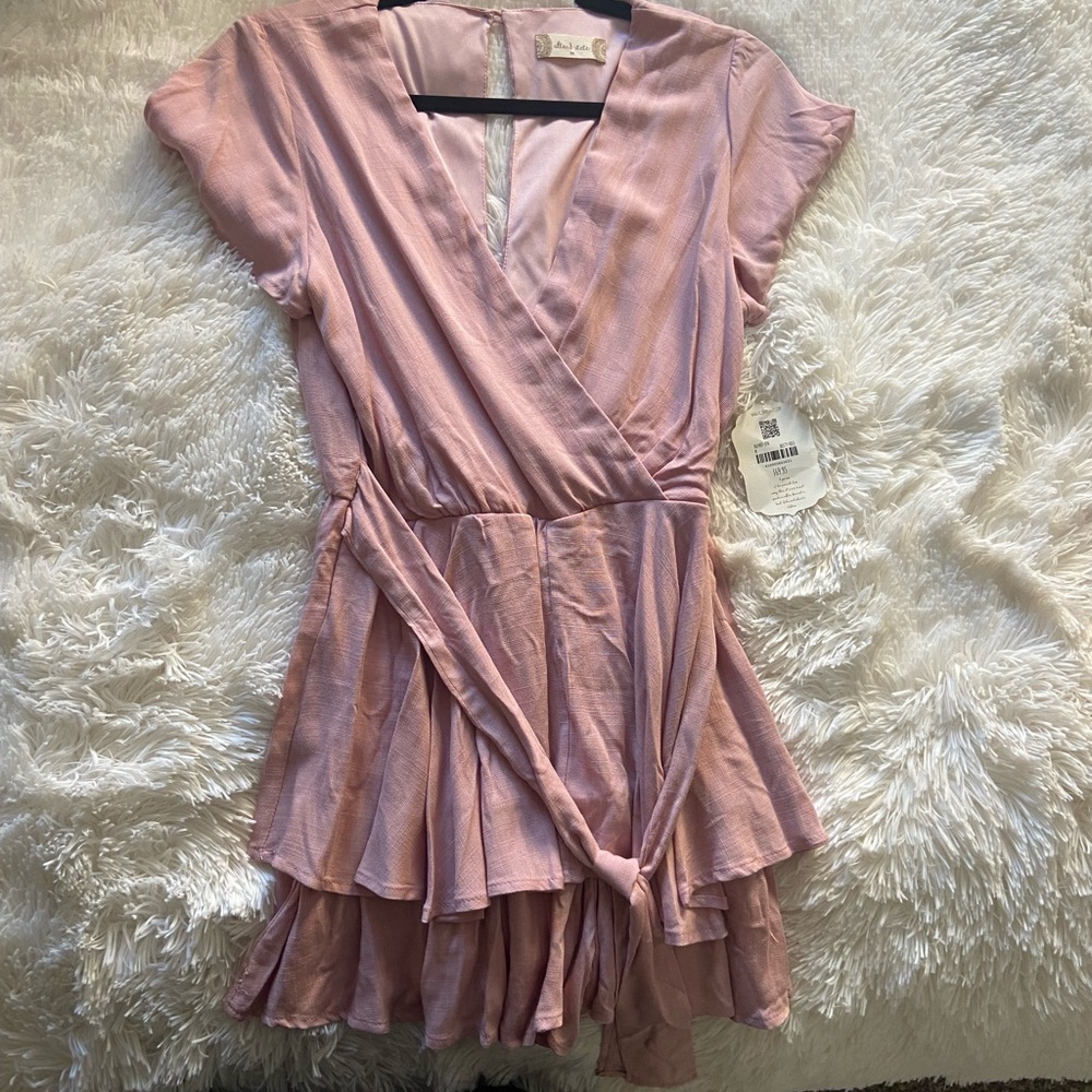 Color - dusty rose.    Romper on the inside dress in the outside.